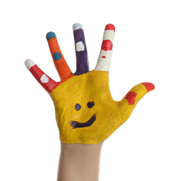Kid with smiling face drawn on palm against white background, closeup