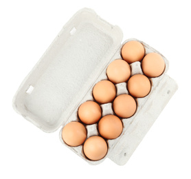 Photo of Raw chicken eggs in carton isolated on white, top view