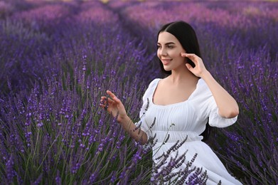 Portrait of beautiful young woman in lavender field