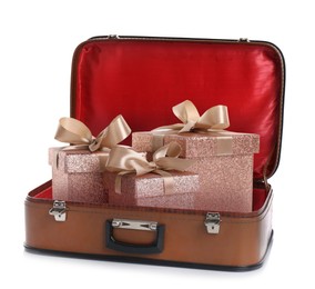 Beautiful gift boxes in retro suitcase on white background