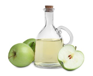 Photo of Fresh ripe green apples and jug of juice on white background