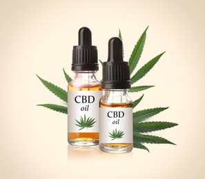 Bottles of cannabidiol tincture and hemp leaves on beige background