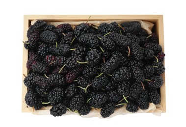 Ripe black mulberries in wooden box on white background, top view