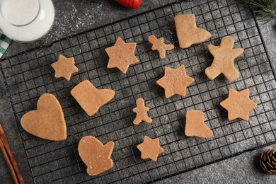Photo of Homemade Christmas cookies. Flat lay composition with raw gingerbread biscuits on grey table