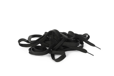 Long black shoe laces on white background
