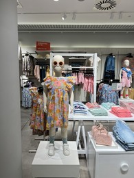 Photo of WARSAW, POLAND - JULY 23, 2022: Modern boutique with stylish children clothes