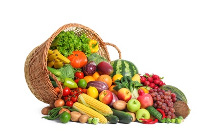 Assortment of fresh organic fruits and vegetables on white background