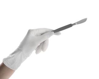 Doctor holding surgical scalpel on white background, closeup. Medical instrument