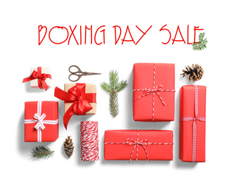Flat lay composition with gifts and text Boxing Day Sale on white background