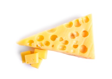 Photo of Pieces of cheese with holes on white background, top view