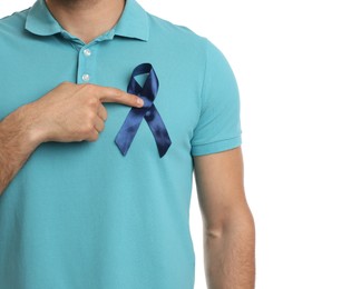 Photo of Man with blue ribbon on white background, closeup. Urology cancer awareness