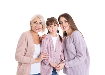 Portrait of beautiful mature woman with daughter and grandchild on white background