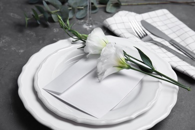 Elegant festive table setting on dark grey background