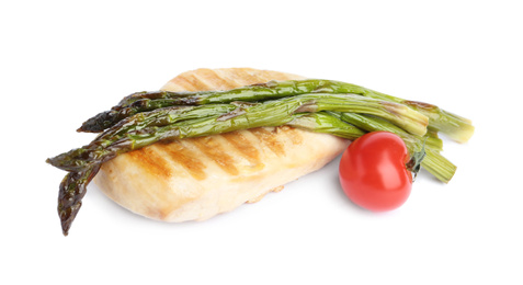Tasty grilled chicken fillet with asparagus and cherry tomato isolated on white