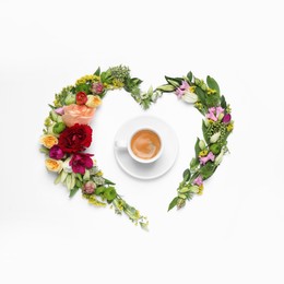 Beautiful heart shaped floral composition with cup of coffee on light background, flat lay