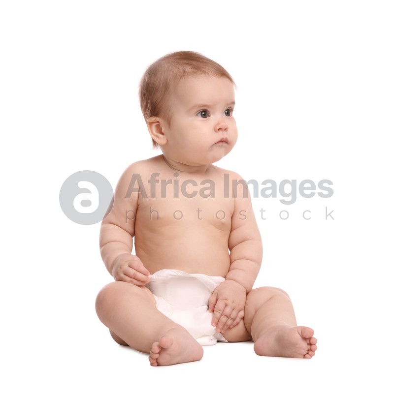 Cute little baby in diaper sitting on white background