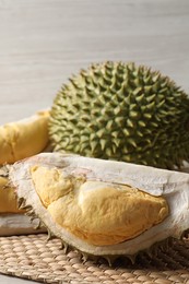 Fresh ripe durian fruits on wicker mat