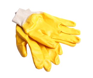 Photo of Yellow gardening gloves on white background, top view