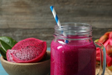 Delicious pitahaya smoothie in mason jar, closeup. Space for text