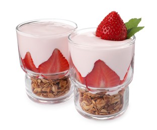 Glasses of tasty yogurt with muesli and strawberries isolated on white
