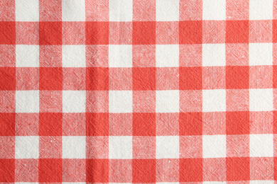 Texture of red checkered fabric as background, closeup
