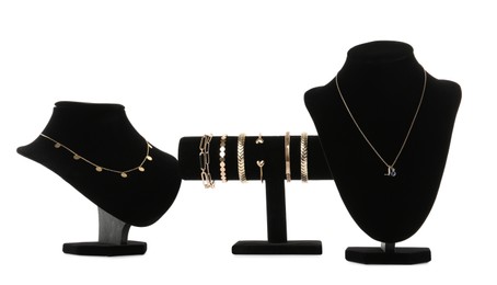 Photo of Different display stands with stylish jewelry on white background