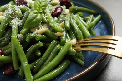 Tasty salad with green beans served on grey table, closeup
