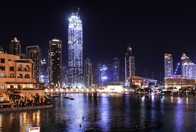 DUBAI, UNITED ARAB EMIRATES - NOVEMBER 04, 2018: Beautiful night cityscape with Burj Khalifa lake at Downtown Dubai