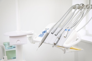 Set of professional equipment in dentist's office. Space for text
