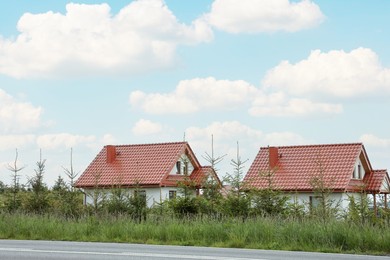 Modern buildings with red roofs outdoors on spring day