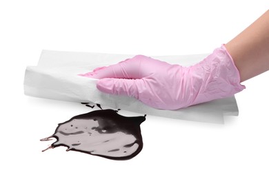 Photo of Woman wiping melted chocolate on white background, closeup