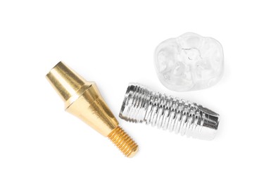 Parts of dental implant on white background, top view