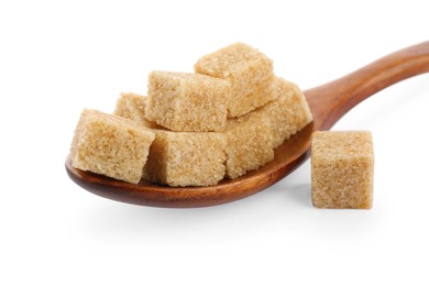 Brown sugar cubes and wooden spoon isolated on white, closeup