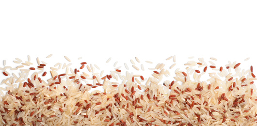Mix of brown and polished rice on white background, top view
