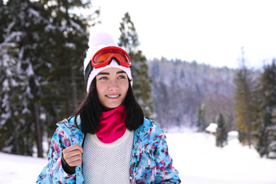 Photo of Young woman at mountain resort. Winter vacation