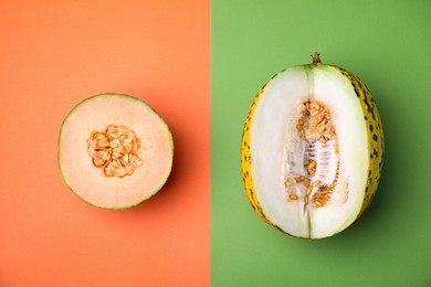 Cut different types of melons on color background, flat lay