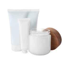 Jar and tubes of hand cream on white background