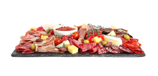 Slate plate with prosciutto and other delicacies isolated on white