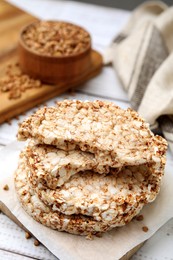Stack of crunchy buckwheat cakes on white wooden table