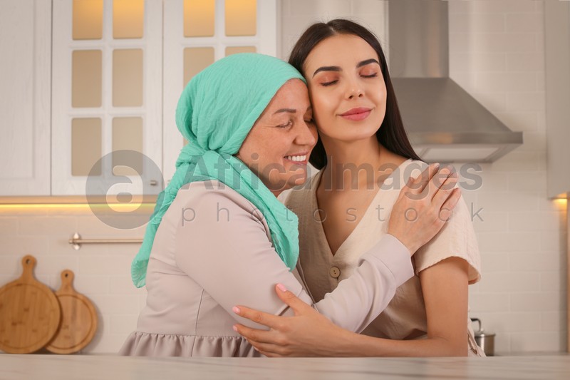 Photo of Young woman visiting her mother with cancer indoors