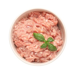 Raw chicken minced meat with basil in bowl on white background, top view
