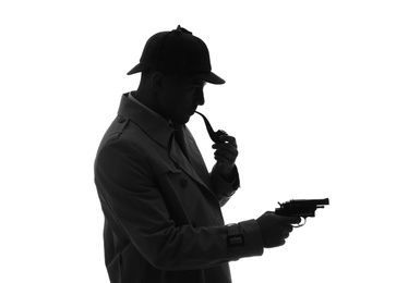 Old fashioned detective with smoking pipe and revolver on white background