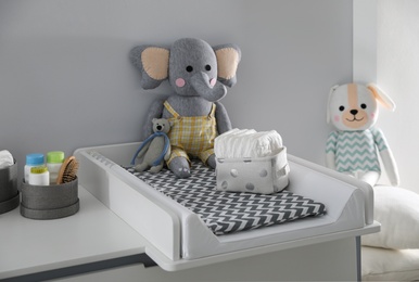 Modern changing table in baby room. Interior design