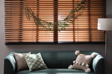 Stylish room decorated with beautiful eucalyptus garland