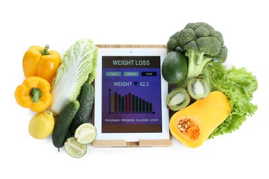 Photo of Tablet with weight loss calculator application and food products on white background, top view