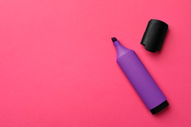 Photo of Bright purple marker on pink background, flat lay. Space for text