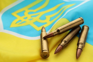 Bullets on national flag of Ukraine, closeup