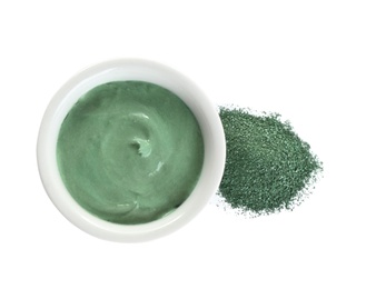 Photo of Freshly made spirulina facial mask in bowl and powder on white background, top view