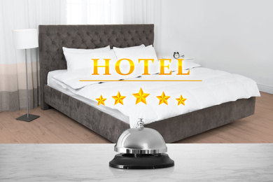 Image of 5 Star hotel. Reception desk with service bell and view of luxury bedroom on background