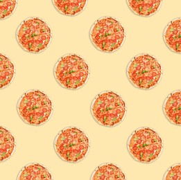 Many delicious Margherita pizzas on beige background, flat lay. Seamless pattern design